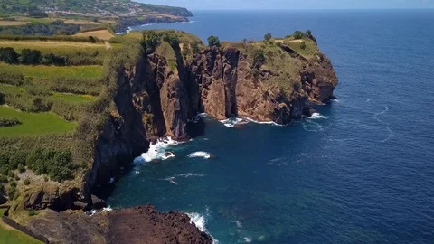 Aerial shot of cliffs and impressive rock at the coast of sao miguel an island o Stock Footage 94384952