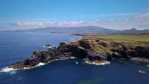 Aerial shot of cliffs and impressive rock at the coast of sao miguel an island o Stock Footage 94384993