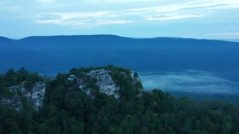 An aerial shot (clockwise orbit) of Big Schloss and the Trout Run Valley Stock Footage 140540524