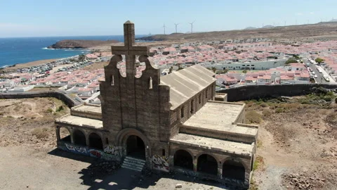 Aerial shot close and in orbit to the church in leper colony in Tenerife Stock Footage 228880148