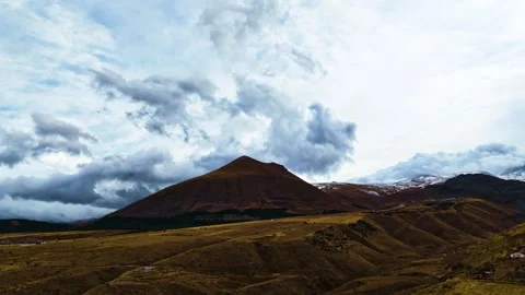 Aerial Shot of Clouds Passing Over Mountains as Winter Begins Stock Footage 293085706