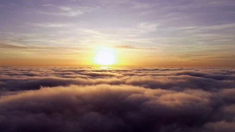 Aerial shot of cloudscape against sky during beautiful sunset Stock Footage