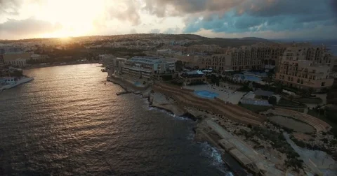 Aerial shot on a cloudy day during sunset in Malta Stock Footage 70926477