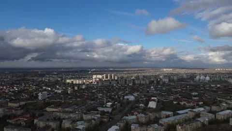Aerial shot of cloudy sky after rain  Shooting the city from a drone City video Stock Footage 231629577