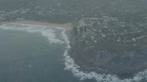 Aerial Shot of Coastal Cliffs, Beach, and Suburban Area in Sydney, New South Stock Footage 345733769