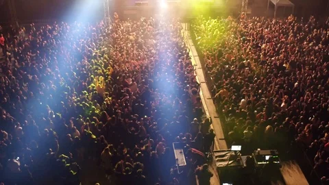 Aerial shot of a concert at night in the open air Stock Footage