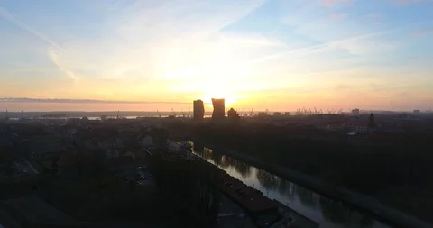Aerial shot of a construction crane at sunset. City silhouettes in the dusk - 5 Stock Footage 87569079