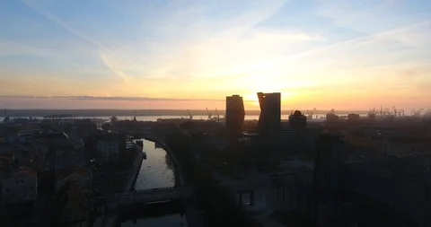 Aerial shot of a construction crane at sunset. City silhouettes in the dusk - 4 스톡 동영상 87569366