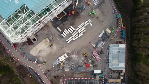 Aerial shot of construction site. Looking down at warehouse being built. Stock-Footage 258304066