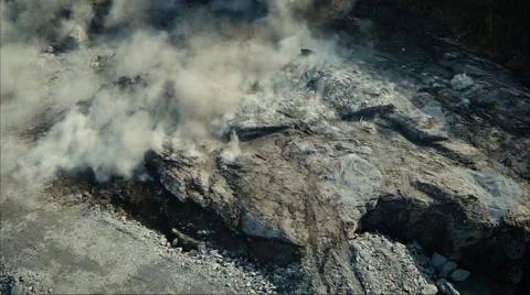 Aerial Shot of Controlled Mining Explosion Stock Footage 65854880