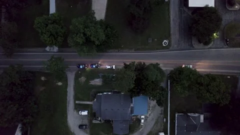An aerial shot of a cop car pulls over a speeding driver on the main road Vídeos de archivo 213494543