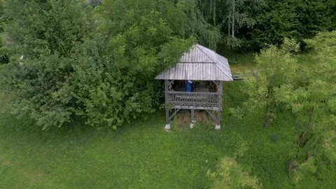 Aerial shot of cottage in the middle of a forest with a beautiful view   Stock Footage