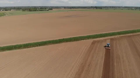 Aerial shot of crops with tractor Stock Footage 89900612