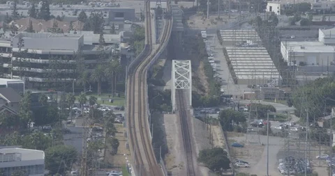 Aerial shot, day, examine elevated train tracks in la neighborhood, drone Stock Footage 115153089