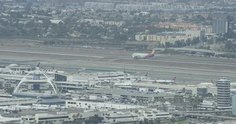 Aerial shot, day, plane touchdown at lax, drone Stock-Footage 115235464