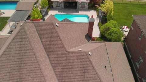 An aerial shot descends down over the roof 스톡 동영상 165244495
