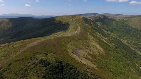 Aerial shot of a dinosaur looking range of the Carpathian Mountains in summer Stock Footage 86606989