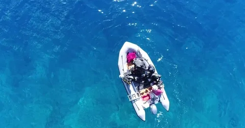 Aerial shot of divers getting ready on a zodiac Stock-Footage 79069198