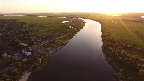 Aerial shot of the Dnipro, its picturesque banks, cottages and trees in summer Stock Footage