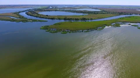 Aerial shot of the Dnipro riverbed with islets and streams at sunset in summer Stock Footage 87007490
