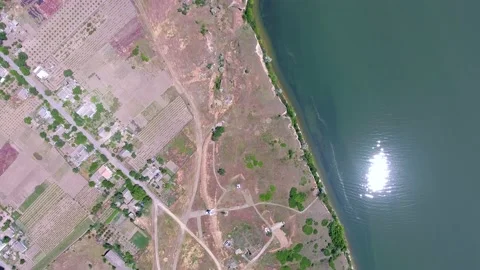 Aerial shot of the Dnipro riverbed with a shining sun reflection in blue waters Stock Footage 88201347
