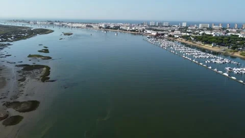 Aerial shot down the river in Punta Umbria Stock Footage 316071808