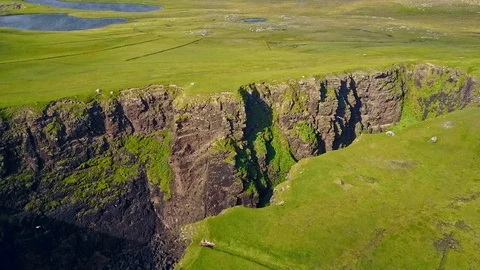 Aerial shot off the dramatic coast line of Shetland, Scotland, Stock Footage 97804927