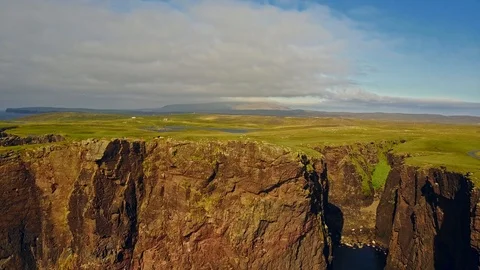 Aerial shot off the dramatic coast line of Shetland, Scotland, Stock Footage 97806957