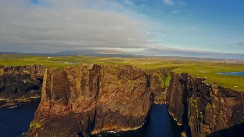 Aerial shot off the dramatic coast line of Shetland, Scotland, Stock Footage 97806964