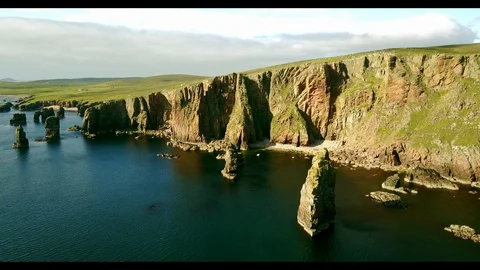 Aerial shot off the dramatic coast line of Shetland, Scotland, Stock Footage 97806983