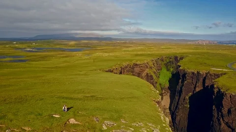 Aerial shot off the dramatic coast line of Shetland, Scotland, Stock Footage 97807005