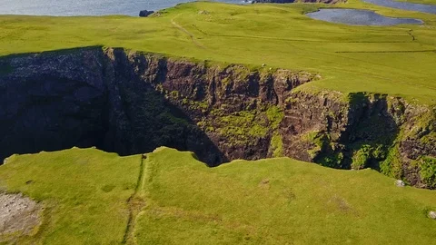 Aerial shot off the dramatic coast line of Shetland, Scotland, Stock Footage 97807167