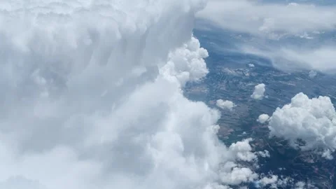 Aerial shot of dramatic cumulus clouds over landscape. Stock Footage 336931099