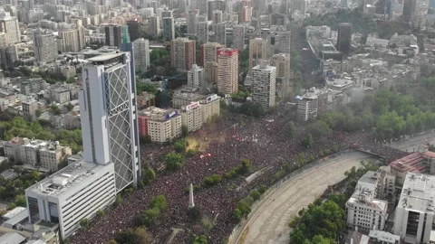 Aerial shot with drone backwards in the largest march in Chile on October 25 Stock Footage 136344140