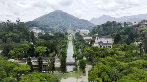 Aerial shot drone flies forward and descends low above a canal with church Vidéo 264838166