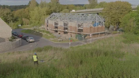 Aerial shot of drone operator doing site inspection survey Stock Footage 132876434