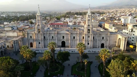 Aerial shot drone orbits to left in tight shot of Arequipa Basilica Cathedral Stock Footage 243683542
