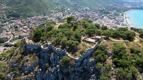 Aerial shot drone orbits to the left around the castle on top of La Rocca Stock Footage 245341890