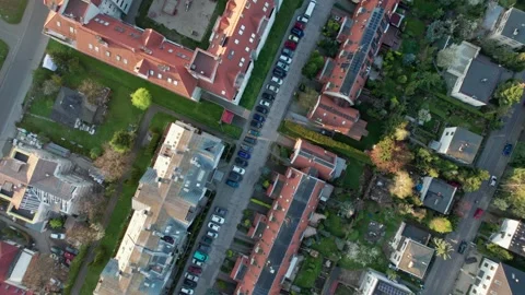 An aerial shot of a drone soaring over houses in a residential neighborhood.. Video stock 240927530