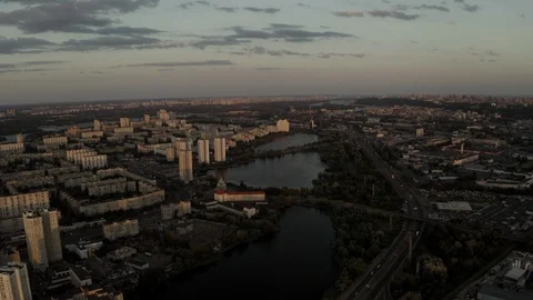 Aerial Shot drone view Flying directly above the city at sunset on lakes and hou Stock Footage 111908627