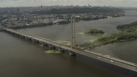 Aerial Shot drone view Flying along the south bridge in Kiev, Ukraine, where a g Stock Footage 112150486