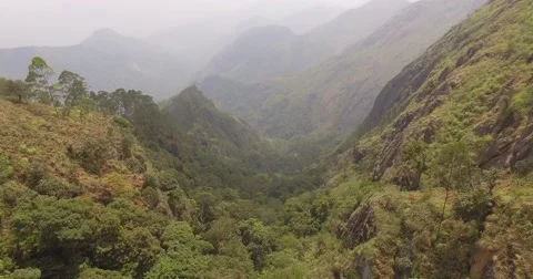 Aerial shot, dropping down into valley in Southern India Stock Footage 61550864