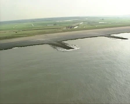 Aerial shot Dutch polder behind sea defence Hondsbossche Zeewering Stock Footage
