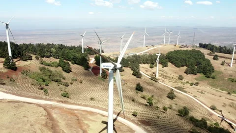 Aerial shot of electric wind generators in Africa Stock Footage 220952679