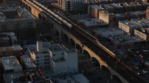 Aerial shot of an elevated subway passing through Queens. Stock Footage 256113176