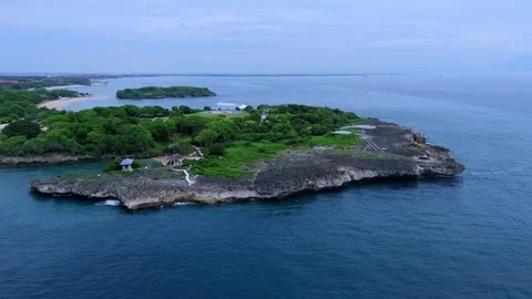 Aerial Shot Emphasizing Tranquil Azure Sea And Verdant Rocky Capes Stock Footage 324701799
