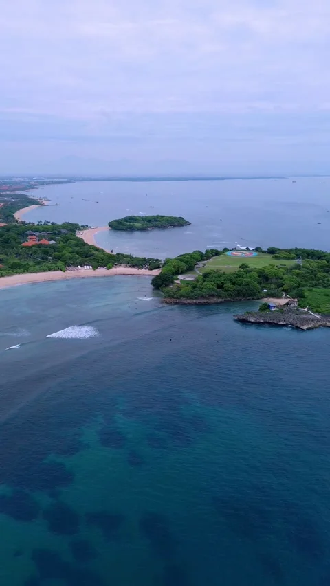 Aerial Shot Emphasizing Tranquil Azure Sea And Verdant Rocky Capes Stock Footage 324827502