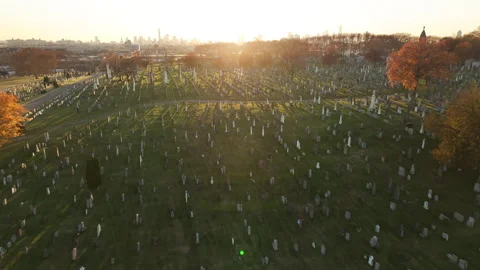 Aerial shot of an empty cemetery during an autumn sunset Stock Footage 256860700