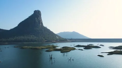 Aerial shot of the engineering marvel that is Karamchat Dam, with water flowing Stock Footage 299244081