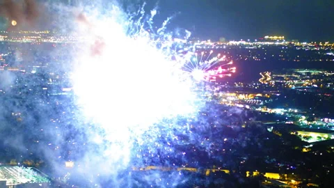 Aerial Shot Of Exploding Fireworks During Celebration In City At Night - Culver Stock Footage 255409133